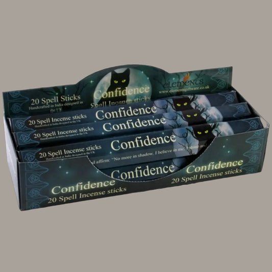 Confidence Spell musk incense, set of six packs with Lisa Parker artwork, on a charcoal background